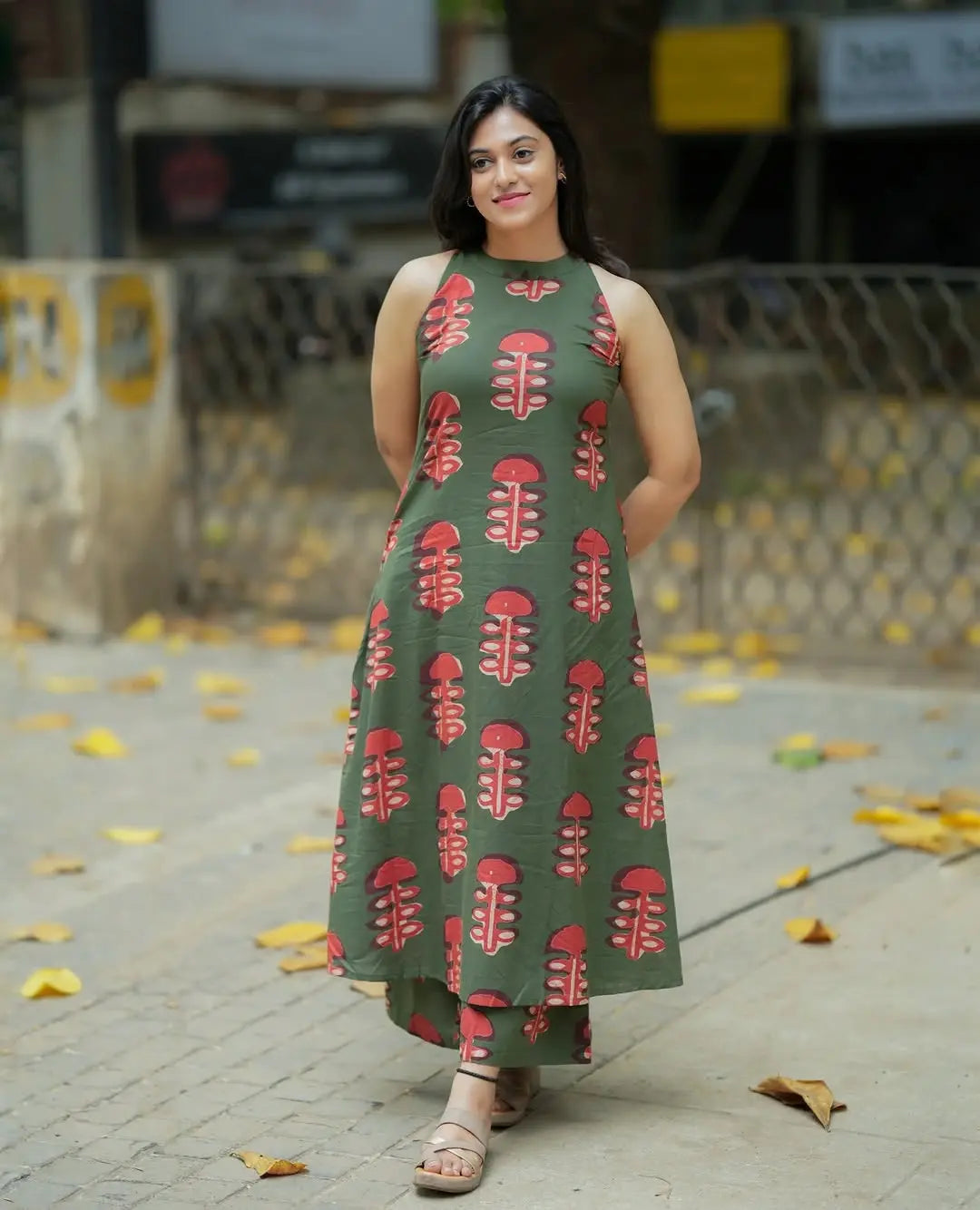 Sleeveless olive green kurti with coral leaf print paired with matching palazzo pants.