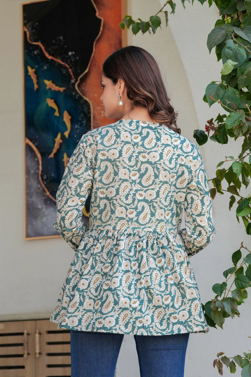 Green paisley printed long kurti top with flared hem and round neckline, shown from back.