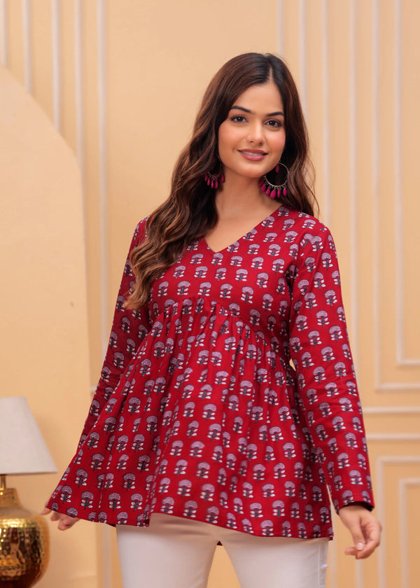 Red printed long kurti with flared silhouette, V-neck, and full sleeves on female model.