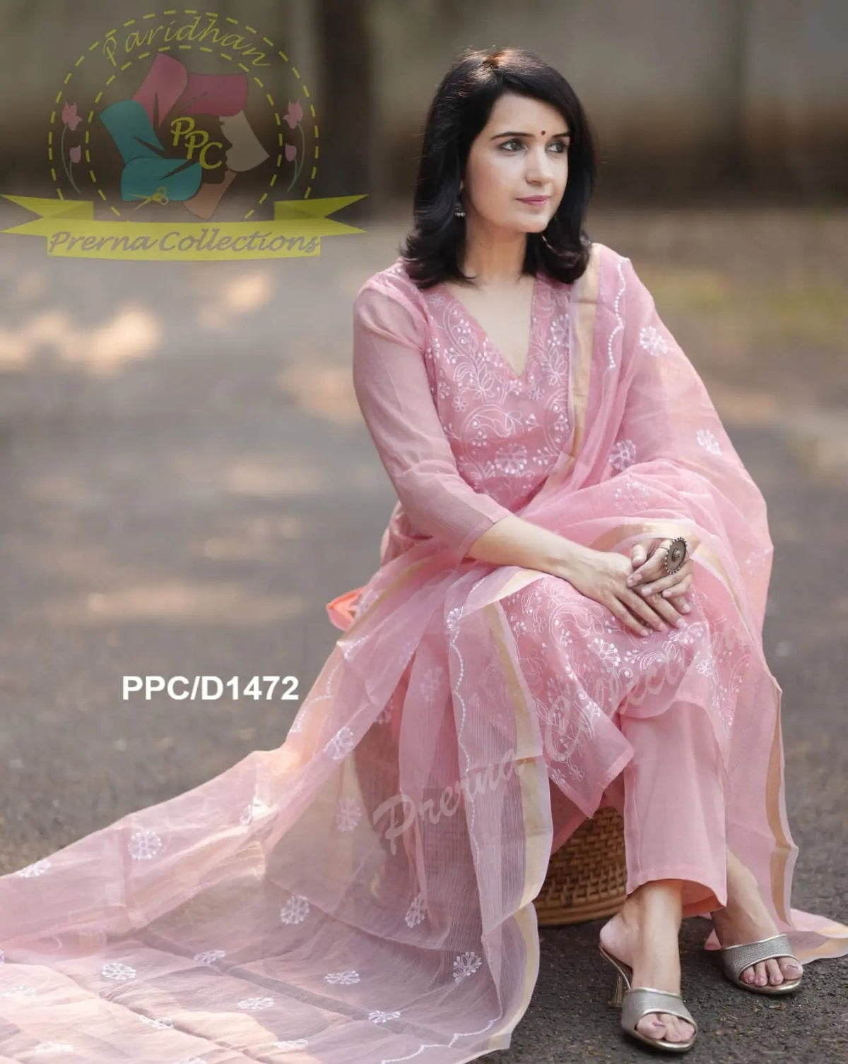 Pink embroidered semi-sheer long dress with matching dupatta and silver sandals.
