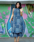 Blue sleeveless printed kurti with high-low hem paired with matching palazzo pants.