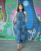Sleeveless blue printed kurti with round neckline and side pockets paired with matching palazzo pants.