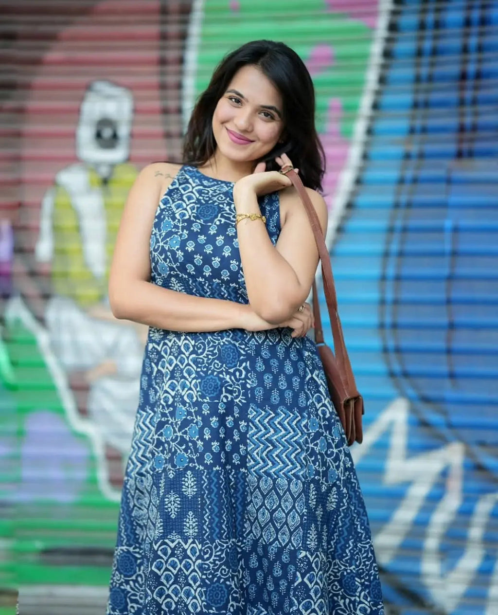 Sleeveless blue printed kurti with round neckline paired with matching palazzo pants.