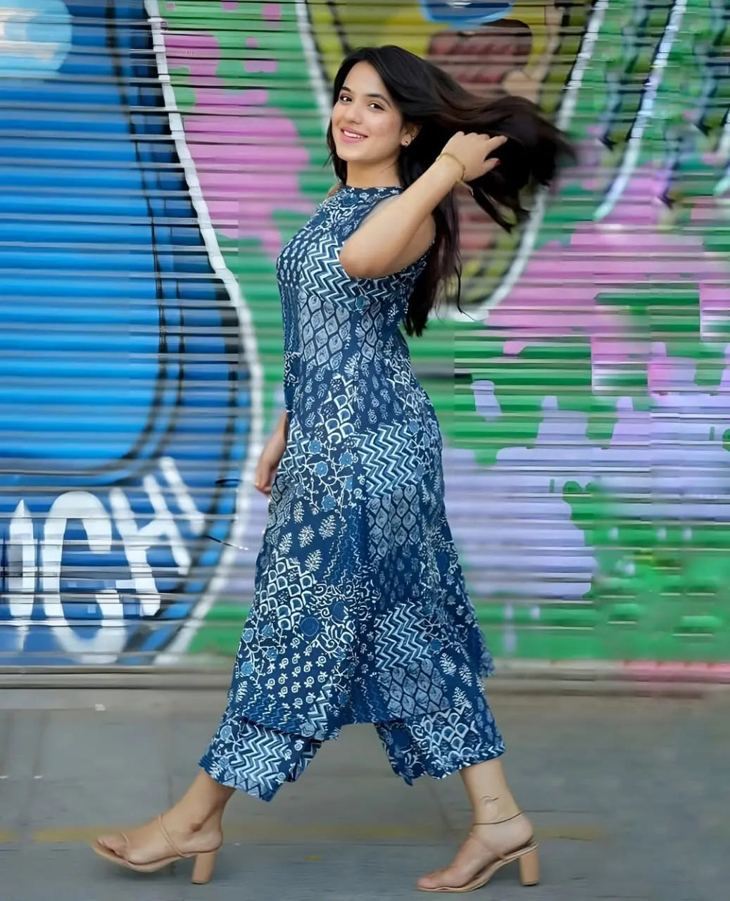 Women’s blue printed kurti with matching palazzo pants and beige block heels.