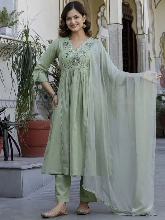 Light green embroidered kurta with matching tapered pants and sheer dupatta.