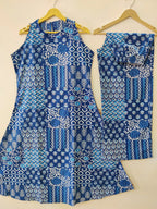 Blue sleeveless kurti with white geometric and floral prints paired with matching palazzo pants.