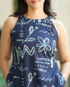 Navy blue sleeveless top with light blue abstract floral and zigzag print.
