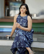 Navy blue sleeveless dress with white floral and text prints, ankle-length, flowy design.