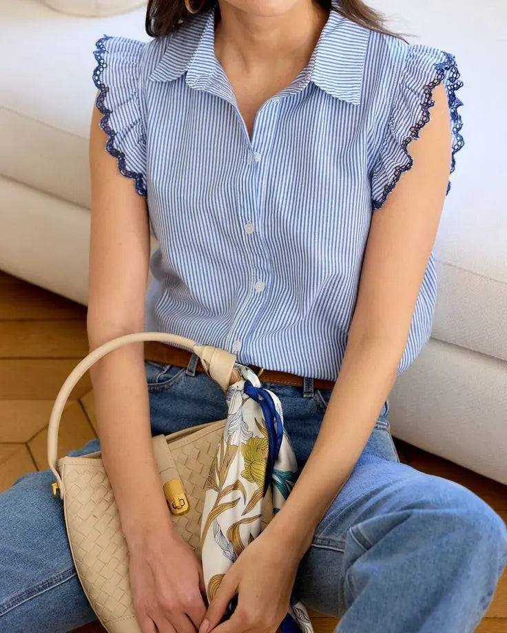 Blue striped blouse with lace-trimmed cap sleeves and button-down front.