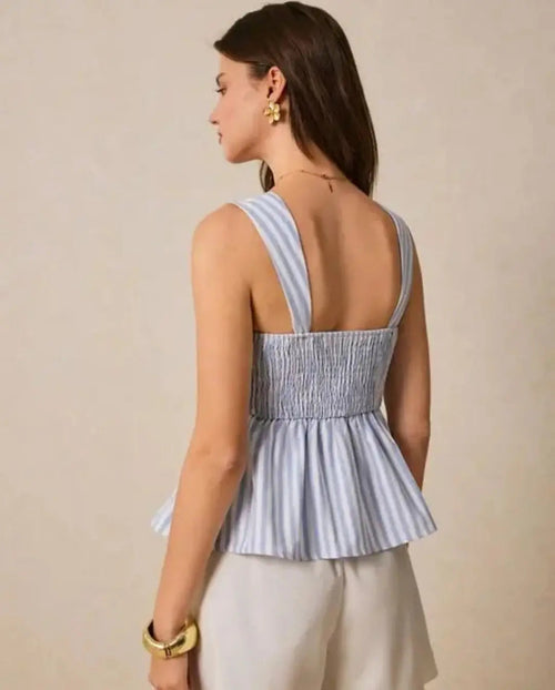 Light blue and white striped sleeveless peplum top with square neckline and smocked back panel.