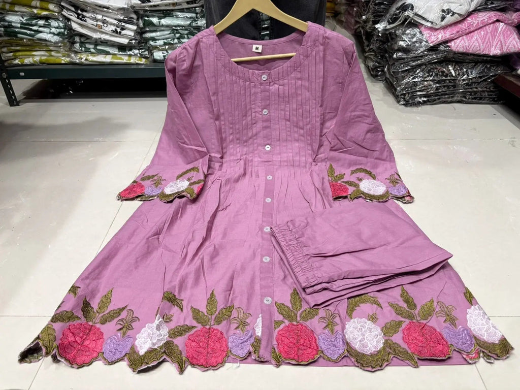 Lavender cotton kurta with floral embroidery on sleeves and hem, paired with matching pants.