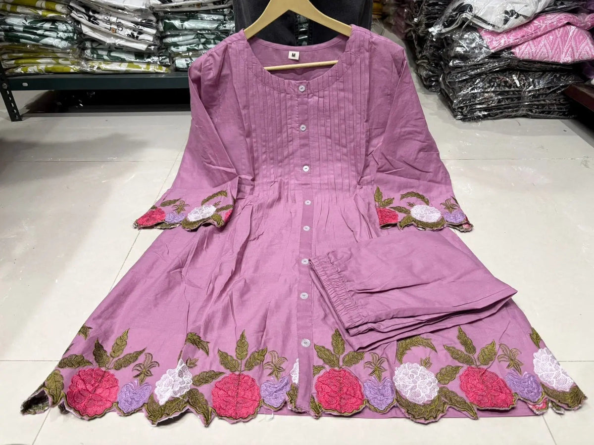 Lavender cotton kurta with floral embroidery on sleeves and hem, paired with matching pants.