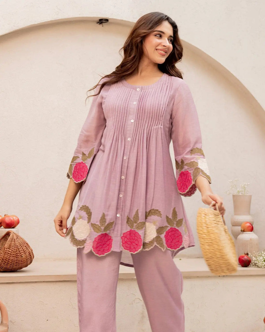 Lavender cotton kurta with pink floral embroidery on hem and cuffs paired with matching straight pants.