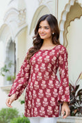 Maroon floral printed cotton kurti with square neckline and flared full sleeves.