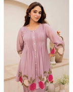 Lavender cotton kurta with floral embroidery and button-down front, paired with matching pants.